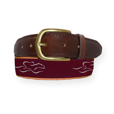 A mens signature canvas and leather belt.  Our signature cardinal and white EMBRACE THE RACE ribbon on a tan backiing adorned with a leather tip and brass buckle.