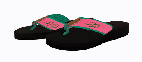 Womens black soled wedge flip flops featuring our custom pink and green ribbon on green backing.