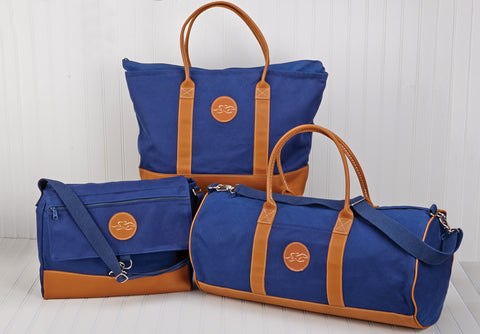 23"W x 14"H x 6"D Large navy canvas and leather tote bag perfect for a night away!  Leather handles, bottom, trim and EMBRACE THE RACE logo!  
