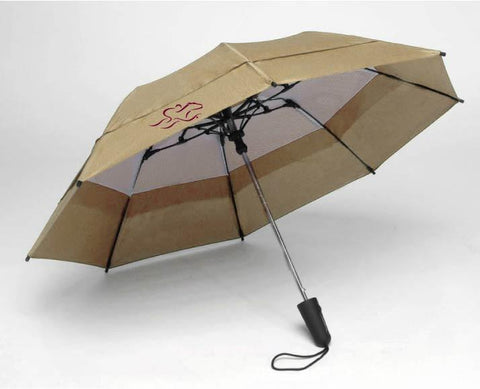 A tan EMBRACE THE RACE windbrella with our horse racing icon on one side and our wordmark on the other in cardinal.  