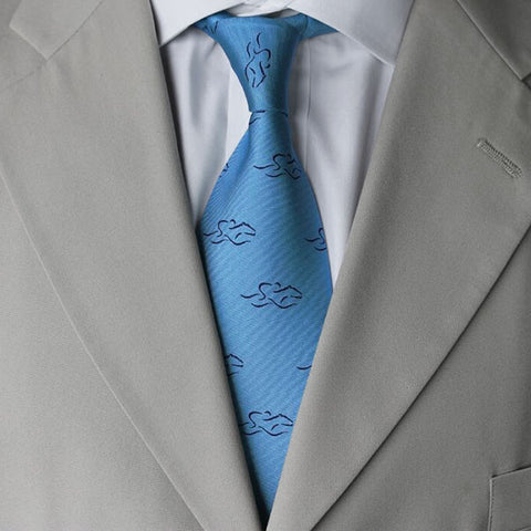 Beautiful light blue 100% silk tie printed with our navy EMBRACE THE RACE icon. 